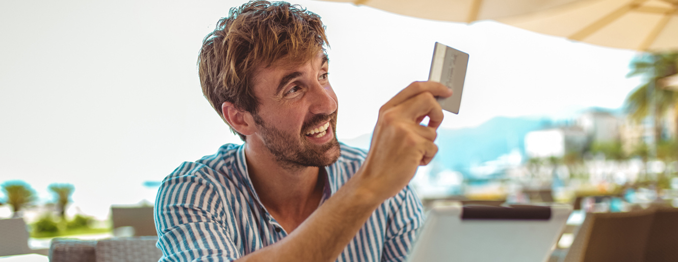 Man giving his credit card to pay for services.